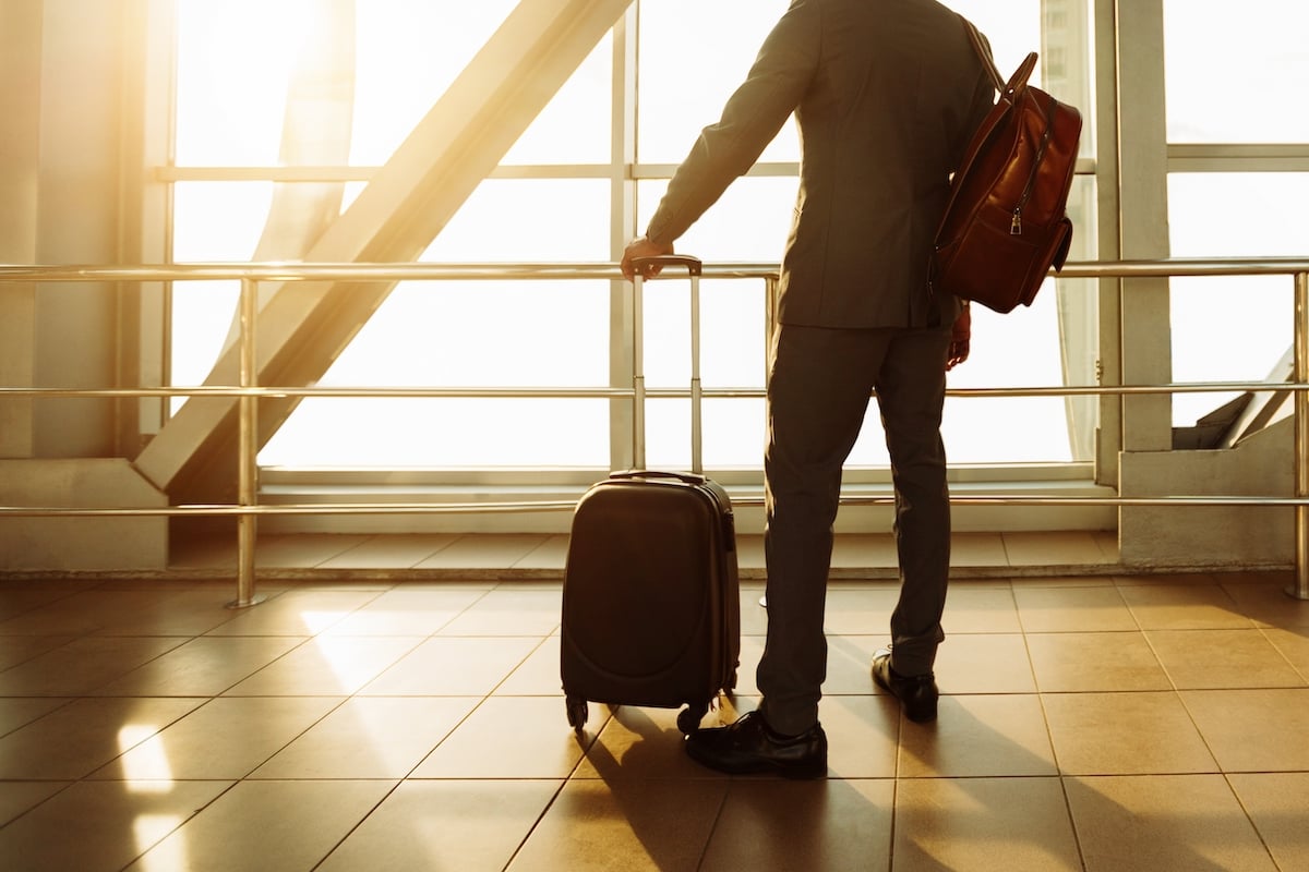Businessman at Airport Terminal Boarding Gate Looking Through Window, Free Space