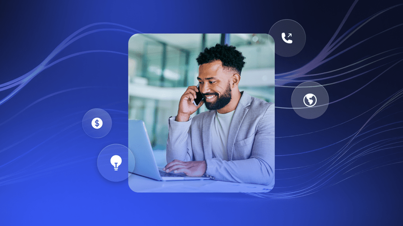 Man working on laptop while talking on smartphone, surrounded by icons including dollar sign, light bulb, and phone to indicate conversational AI.