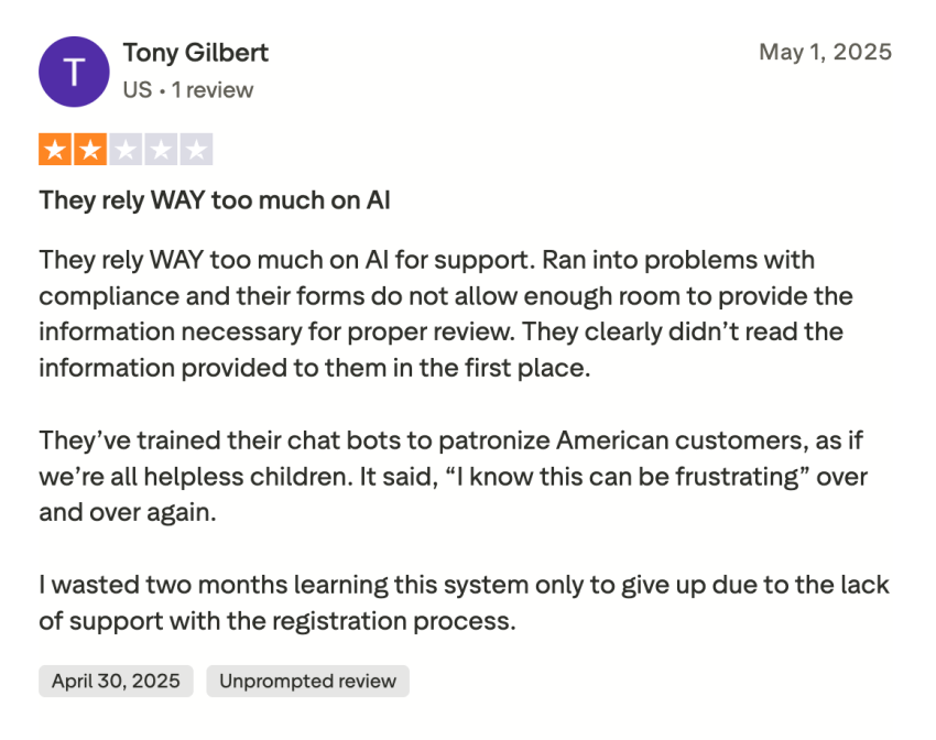 2-star Trustpilot user review of JustCall, saying that it relies way too much on AI